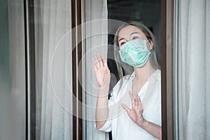 Horizontal background woman in isolation at home for virus outbreak or hypochondria photo