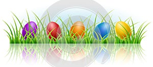 Horizontal banner with Easter eggs in grass