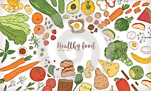 Horizontal banner with frame consisted of different healthy or wholesome food, fruit and vegetable slices, nuts, eggs photo
