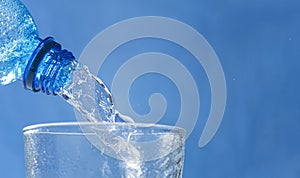 Horizontal banner with Fresh and cool water flowing from the bottle neck