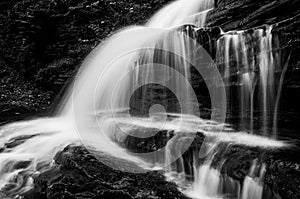 Horizontal black and white image of Onondaga Falls, in Ricketts Glen State Park