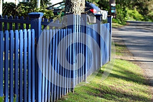 Horizontal blue picket fence with posts