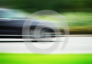 Horizontal car on road motion blur background