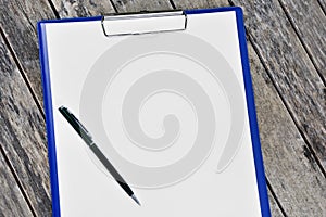 Horizontal clipboard with blank white paper and pen