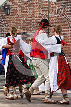 Horizontal colour image of female polish dancers in traditional