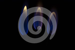 Three flames on the black background
