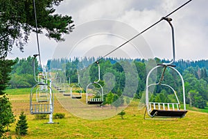 horizontal frame empty ski lifts on a cloudy