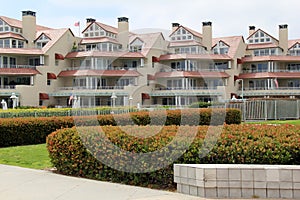 Horizontal image of contemporary architecture with red awnings and outdoor balconies