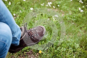 Horizontal image of crossed female legs wearing Alpine Touring R