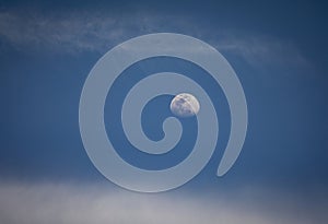 Horizontal image of the moon in the daylight sky