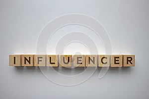 Horizontal Influencer message text on wood blocks on a clear background