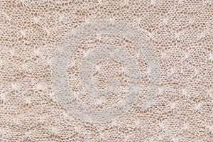 Horizontal knitted background with a recurring homogeneous pattern photo