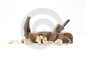 Horizontal low angle studio shot of small vintage wood planed isolated on white background. Old carpenter tool with wood