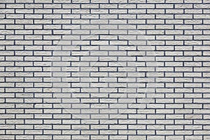 Horizontal part of grey painted brick wall