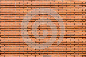 Horizontal part of orange brick masonry wall