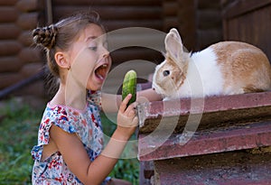 Horizontal photo close-up of a girl with a rabbit