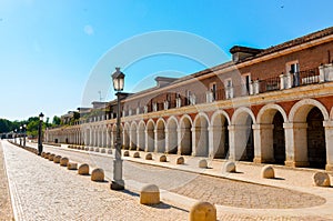 Horizontal photo in color of House of the infants of Aranjuez, path around the palatial building.