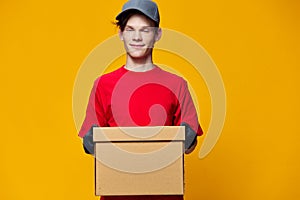 horizontal photo of a happy courier holding a box