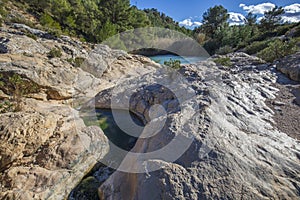 Horizontal photo of the source of Fuente Caputa, between rocks, in the town of Mula photo