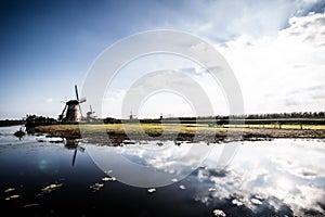 Horizontal picture of the famous Dutch windmills at Kinderdijk, a UNESCO world heritage site. On the photo are five of
