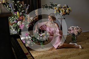 Horizontal portrait of a cute blonde surrounded by flowers