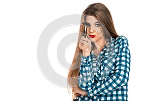 Horizontal portrait of fun makeup artist girl with brush in hand