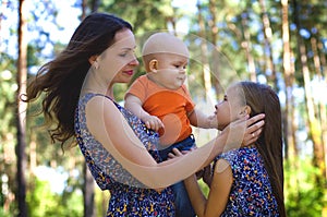 Horizontal portrait of a happy family on a forest background