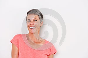 Horizontal portrait of happy older woman on white background