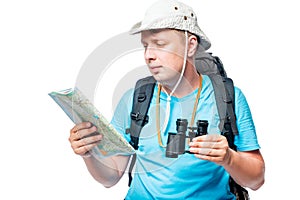 Horizontal portrait of a lost tourist looking at a map