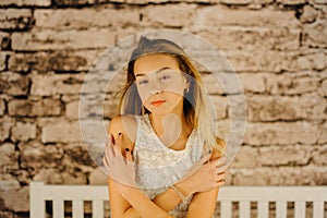 The horizontal portrait of the young blond teenager.