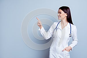 Horizontal portrait of young pretty smiling doc depicted on gray