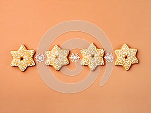 Horizontal row of star-shaped gingerbread cookies.