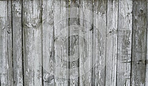 Horizontal rustic weathered old painted wood background with knots and nail holes. Woods texture.