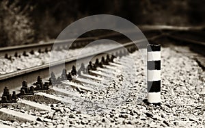 Horizontal sepia railroad milage column bokeh