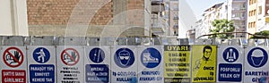 Horizontal Series of Work Safety Signs at a construction site