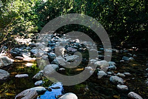 Horizontal shot Buritaca river on the way with crystal clear waters to lost city photo