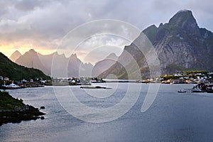 Horizontal shot of the gorgeous view of the lake and mountains in Reine, Norway