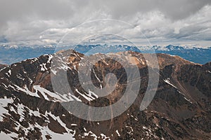 Horizontal shot of mesmerizing view of the snow-covered slopes on a cloudy winter day in the Pyrenees mountains. The