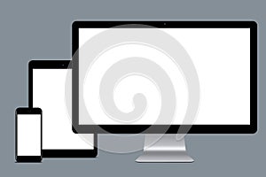 Horizontal shot of modern gadgets with white mock up screens against grey background. Set of mobile phone, tablet computer and