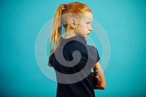 Horizontal shot of offended child, turned away from camera, stands with his back, turns around and gets angry. Malicious