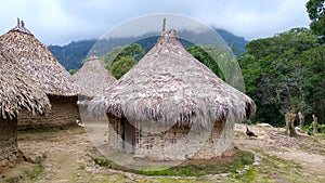 Horizontal shot of Tairona huts on the trail to the \