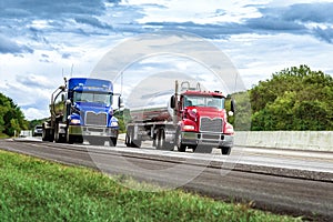 Two Gasoline Tanker Trucks on the Interstate photo