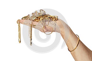 Hand Holding Gold Jewelry photo