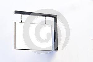 Horizontal signboard or signage on white wall with blank white sign mock up