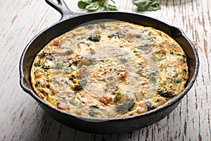 Horizontal view of baked egg frittata with spinach