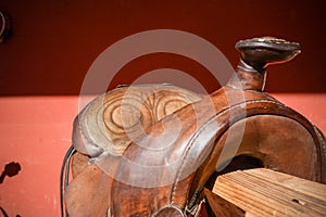 Horizontal View Of Close Up Of An Old Used Brown American Saddle