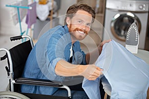horizontal view disabled man during ironing