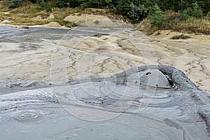 Horizontal view with muddy volcano closeup. Natural park with mu