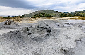 Horizontal view with muddy volcano closeup. Natural park with mu