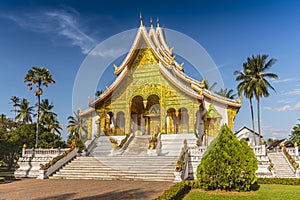 Horizontal view of The Palace chapel or Haw Pha Bang in Luang Prabang on a sunny day, Laos